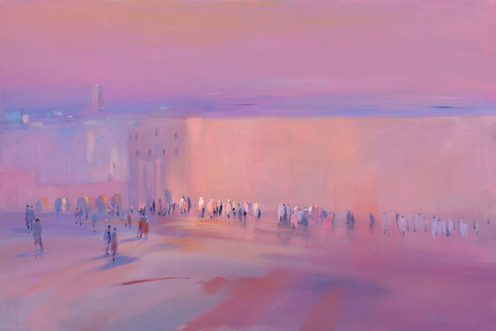 Crowd of people walking through the Kotel captures a serene and peaceful moment as the sun sets, casting a soft pink glow over the scene