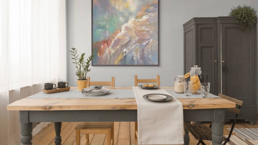 Mocku of "The Journey to Freedom - The Israelites Crossing the Red Sea" behind a dinning room table setup for making home made food. The floor, table and furniture are made out of light wood