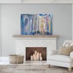 This powerful painting, depicting communal prayer and unity, brings an ancient sense of connection to the space. The vibrant, yet calming tones resonate with the room’s surroundings, creating a peaceful and reflective atmosphere. Set above a simple wooden credenza, it becomes the room's focal point, evoking a deep bond with tradition and shared history. The artwork captures the essence of timeless prayers, connecting the past and present, and grounding the room in a sense of spiritual unity.